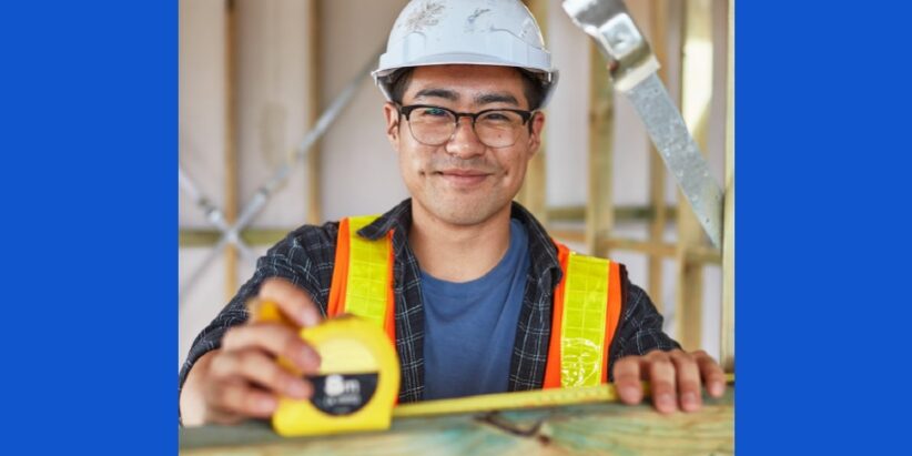 MEGT – Priority Hiring Incentivekjhgsdv young man with safety helmet and glasses, measuring wood beam